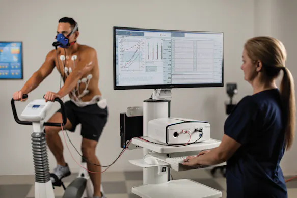 Patient being stationary bike tested on Vyaire's Vyntus™ CPX Metabolic Cart.
